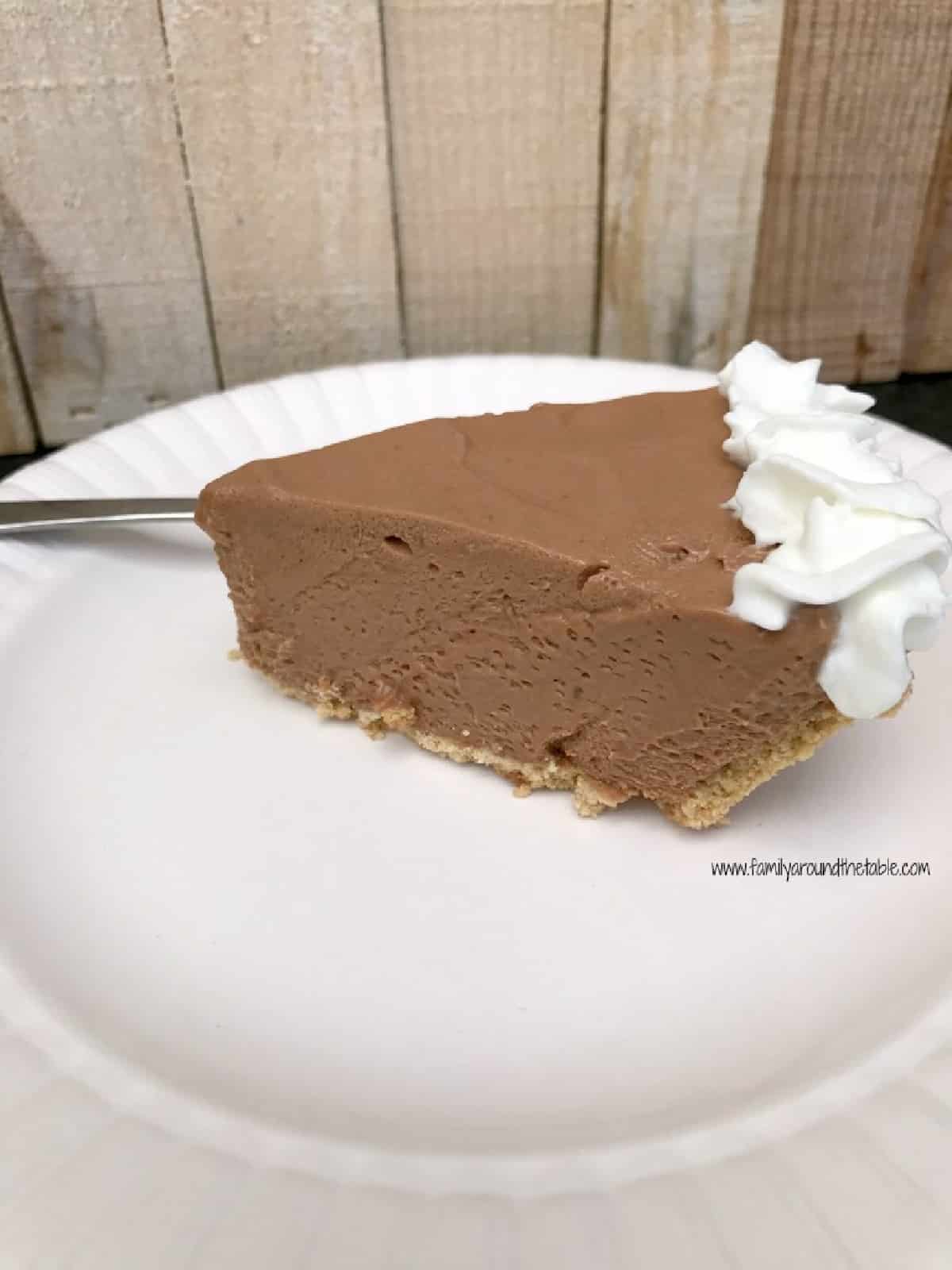 A slice of Hershey bar pie on a white plate.
