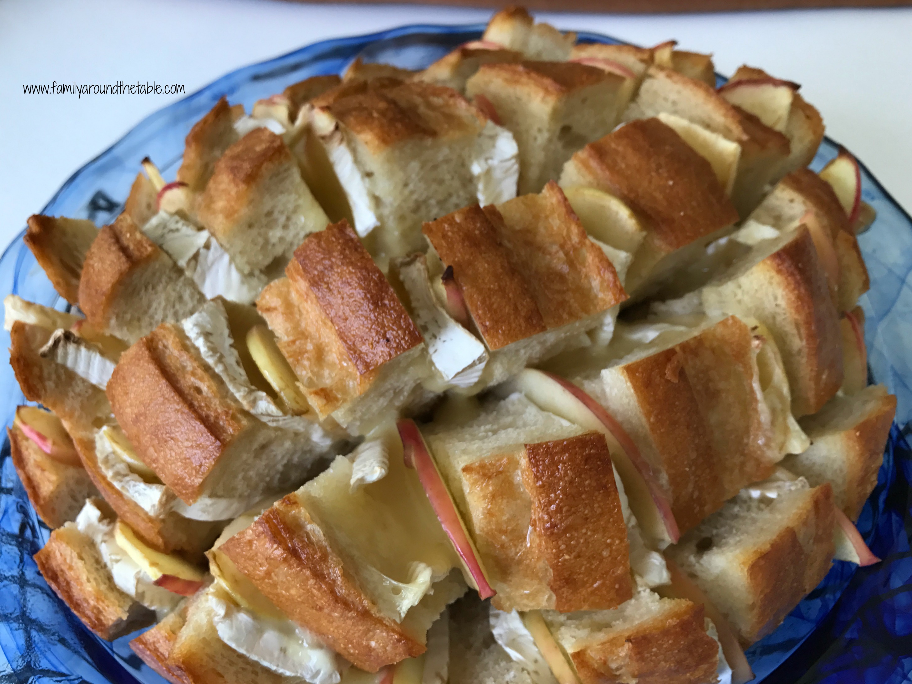 Cheesy Brie and Apple Pull Apart Bread in a blue plate.