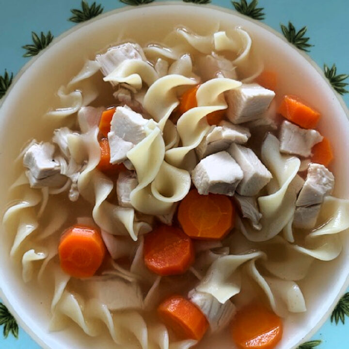 Overhead photo of chicken noodle soup in a bowl.