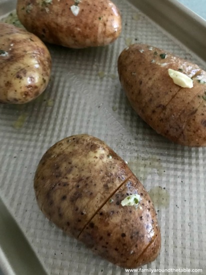 Herbed hasselback potatoes ready for the oven.