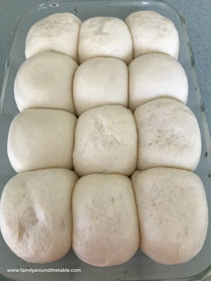 Proofed rolls to make garlic knots.