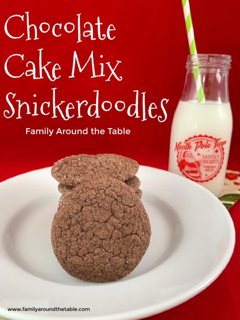 Chocolate cake mix snickerdoodles  on a white plate with a milk bottle of milk in the background.