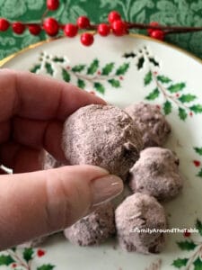 A single hot chocolate ball in a hand.