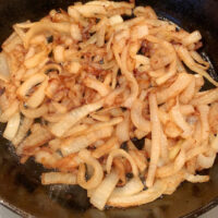 Easy Caramelized Onions in an iron skillet.