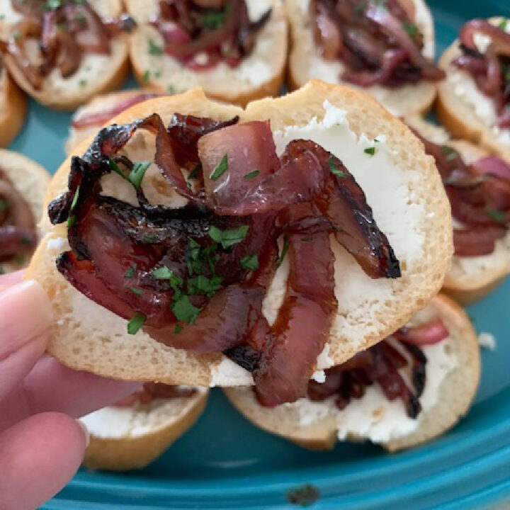 Close up of caramelized onions on a crostini.