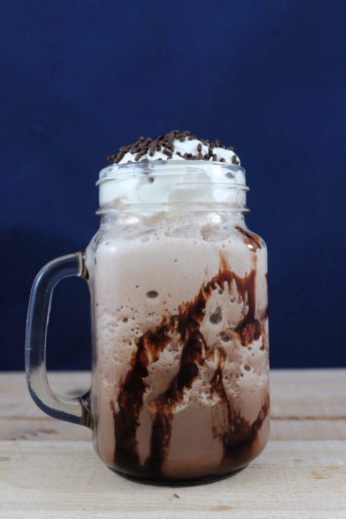 A mug of frozen hot chocolate on a table.