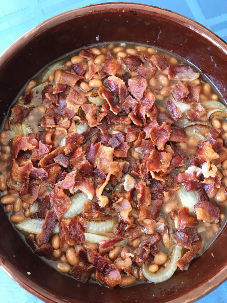 Overhead view of baked beans in a bowl.
