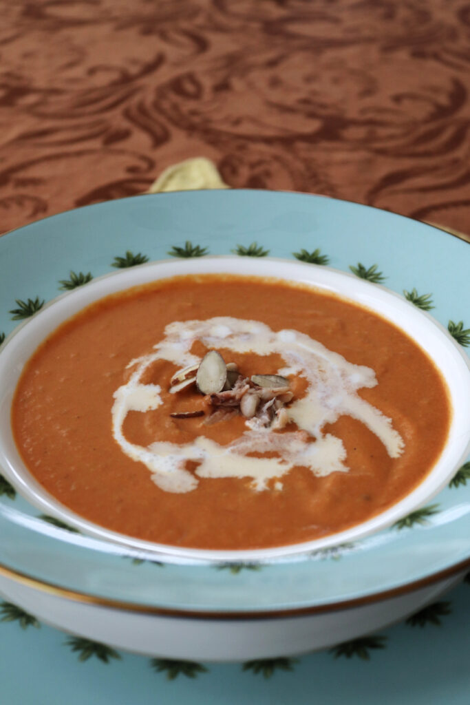 A side view of a bowl of Caribbean pumpkin crab bisque.