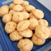 Cheddar Cheese Bites on a blue platter.