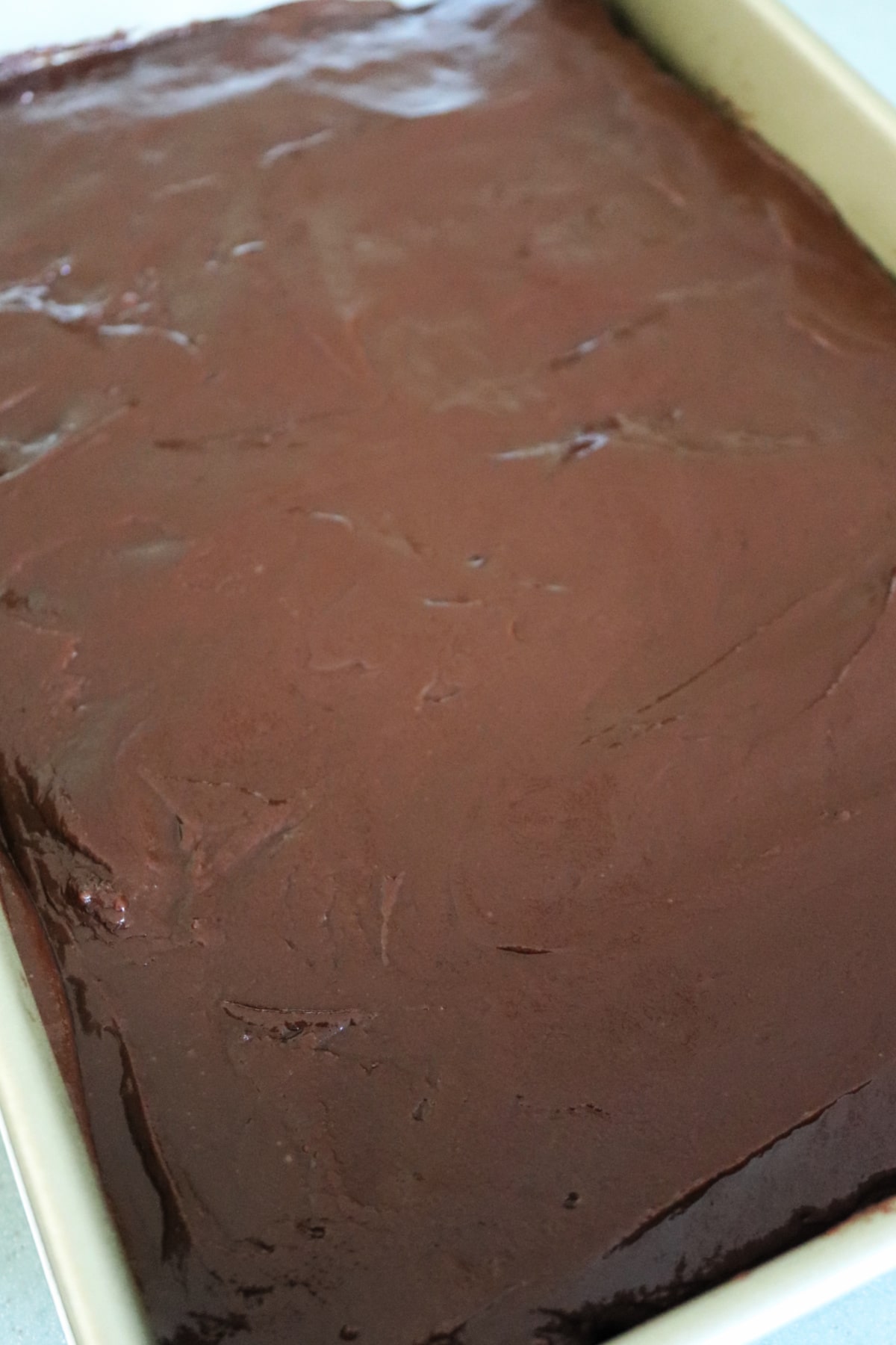 Frosted chocolate cherry bars in the pan.