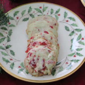 Cherry pistacho cookies on a holly plate.