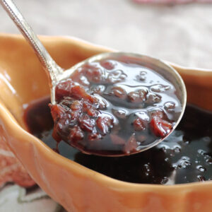 Raisin sauce in a ladle.