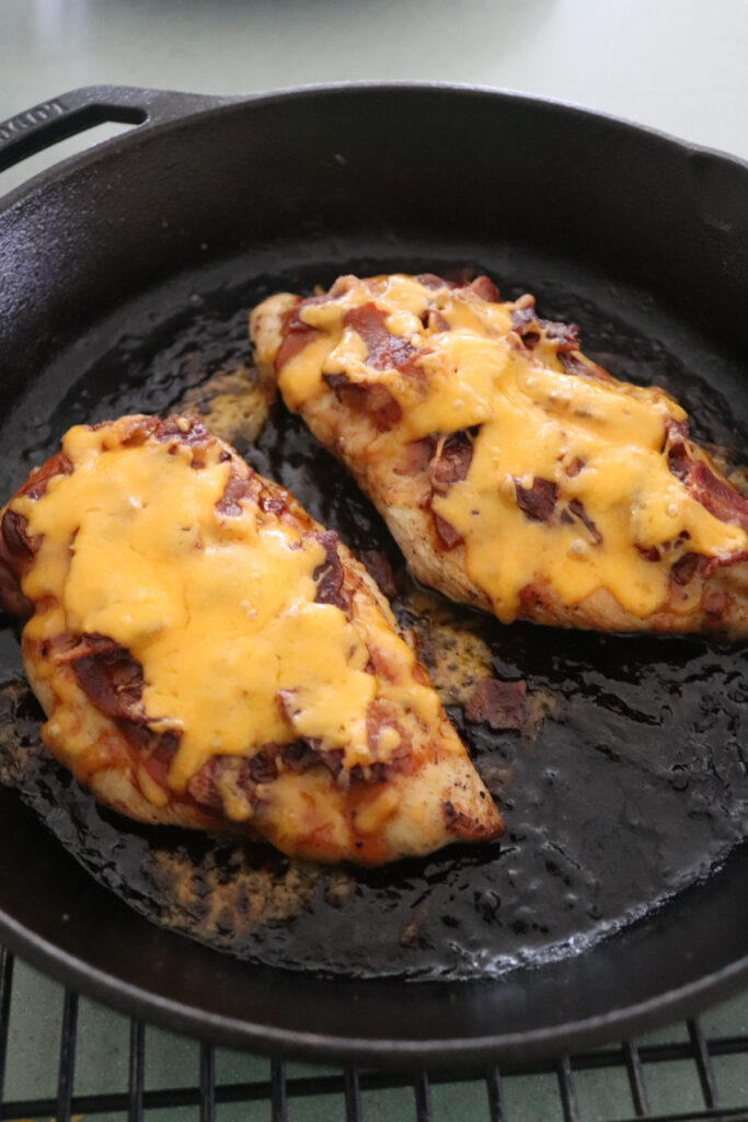 BBQ Chicken Skillet with bacon and cheese in a cast iron skillet.