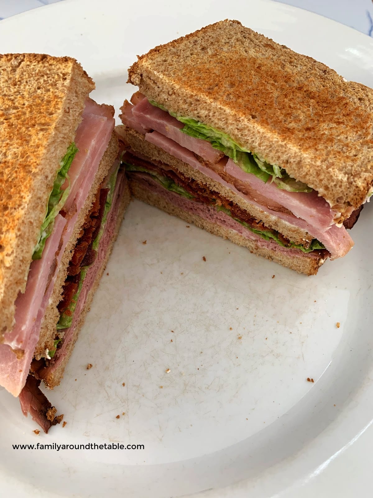 Overhead view of a roast beef club sandwich.